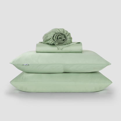 Jogo Lençol de Cima verde bambu by Momo Cotton – tecido de cetim 300 fios, suave, respirável e sustentável.