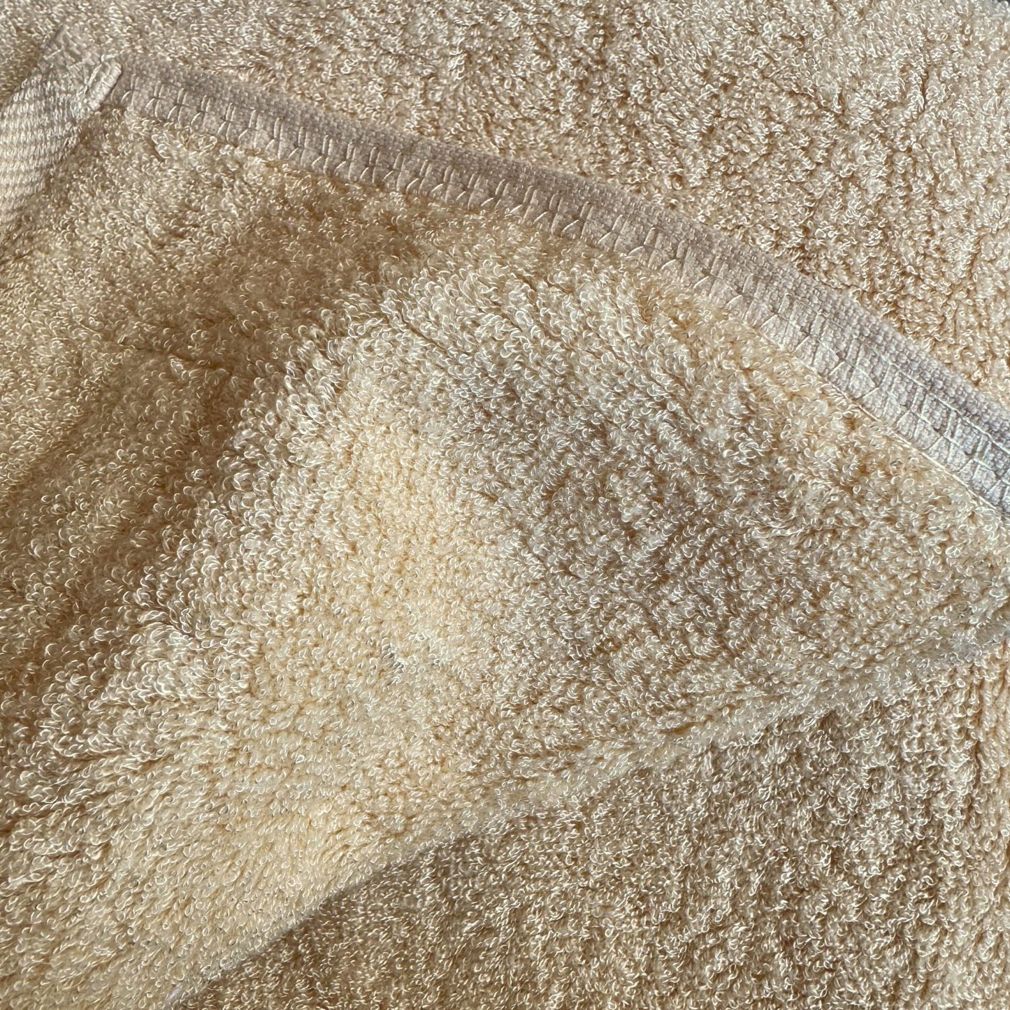 Close-up of beige bamboo towel seams texture – soft, absorbent and sustainable