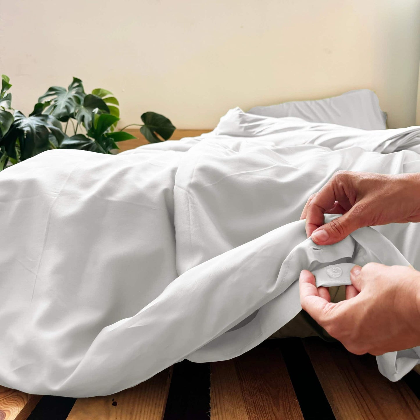Close-up of buttons on white bamboo duvet – soft, breathable and sustainable bedding