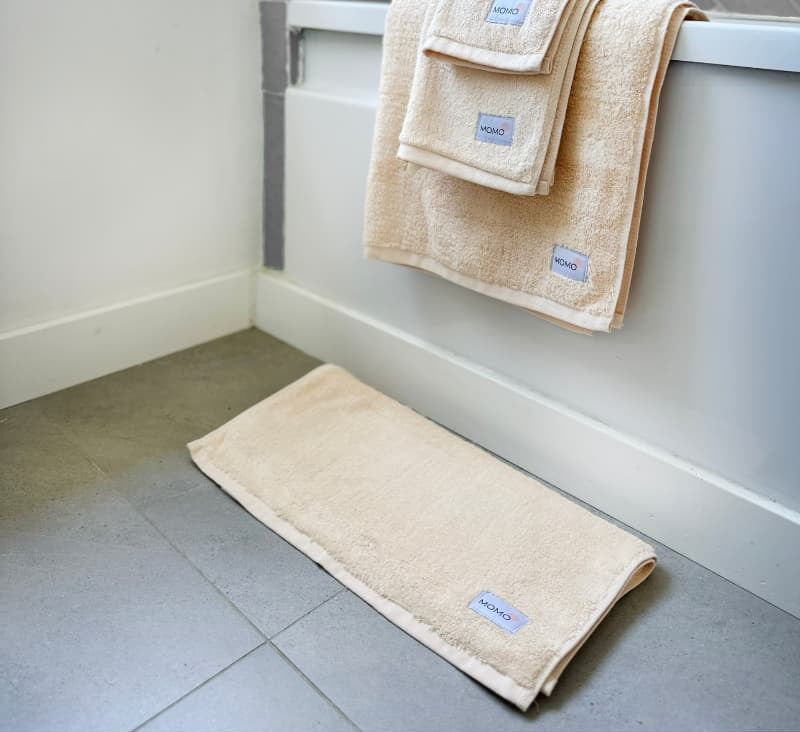 Complete white bamboo towel set on shower – bath, hand and face towels, soft, absorbent and sustainable
