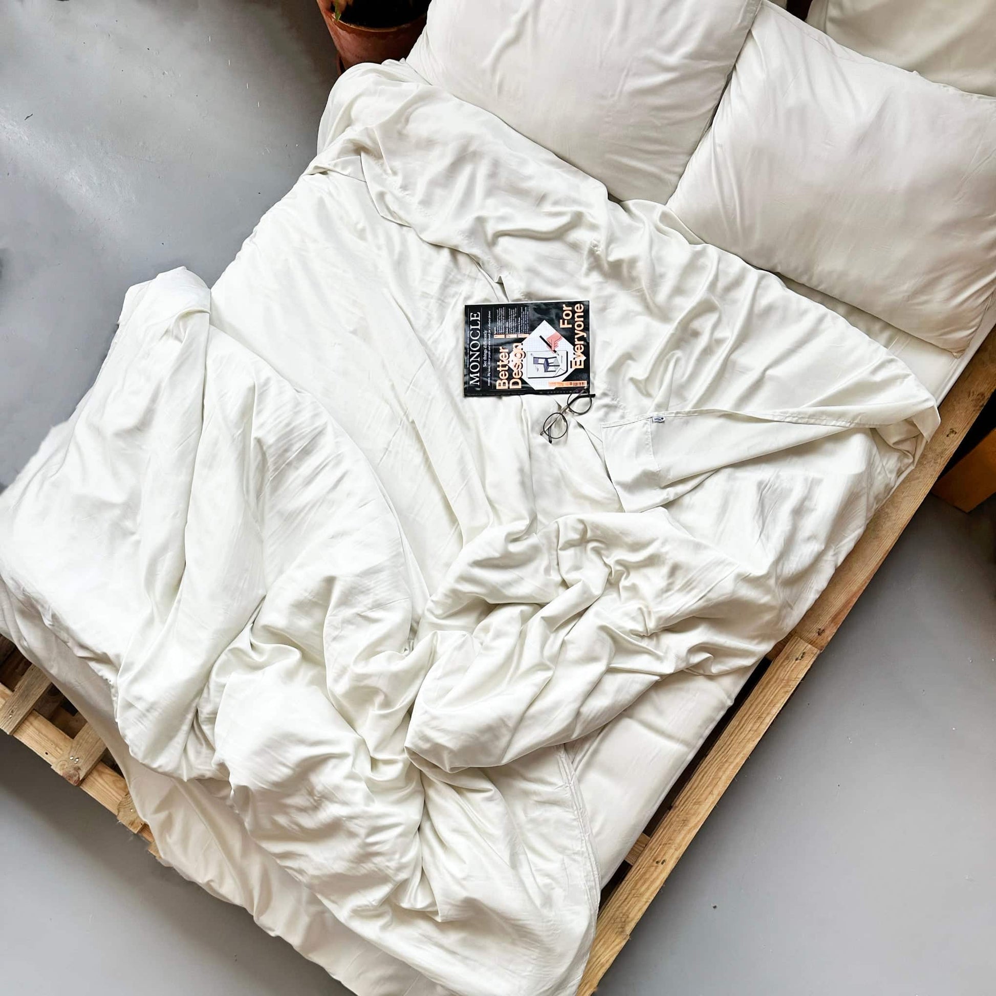 Top view of complete beige bamboo bedding set – duvet, sheets and pillows, soft, breathable and sustainable