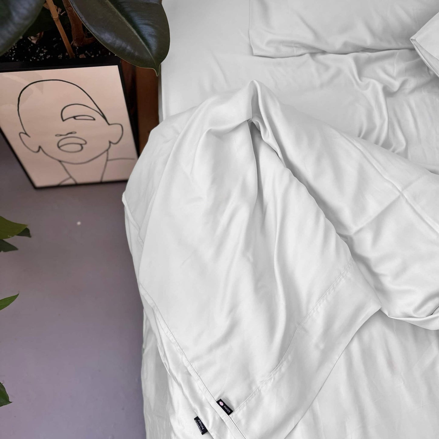 Close-up of white bamboo complete bedding set – duvet, sheets and pillows, soft, breathable and sustainable