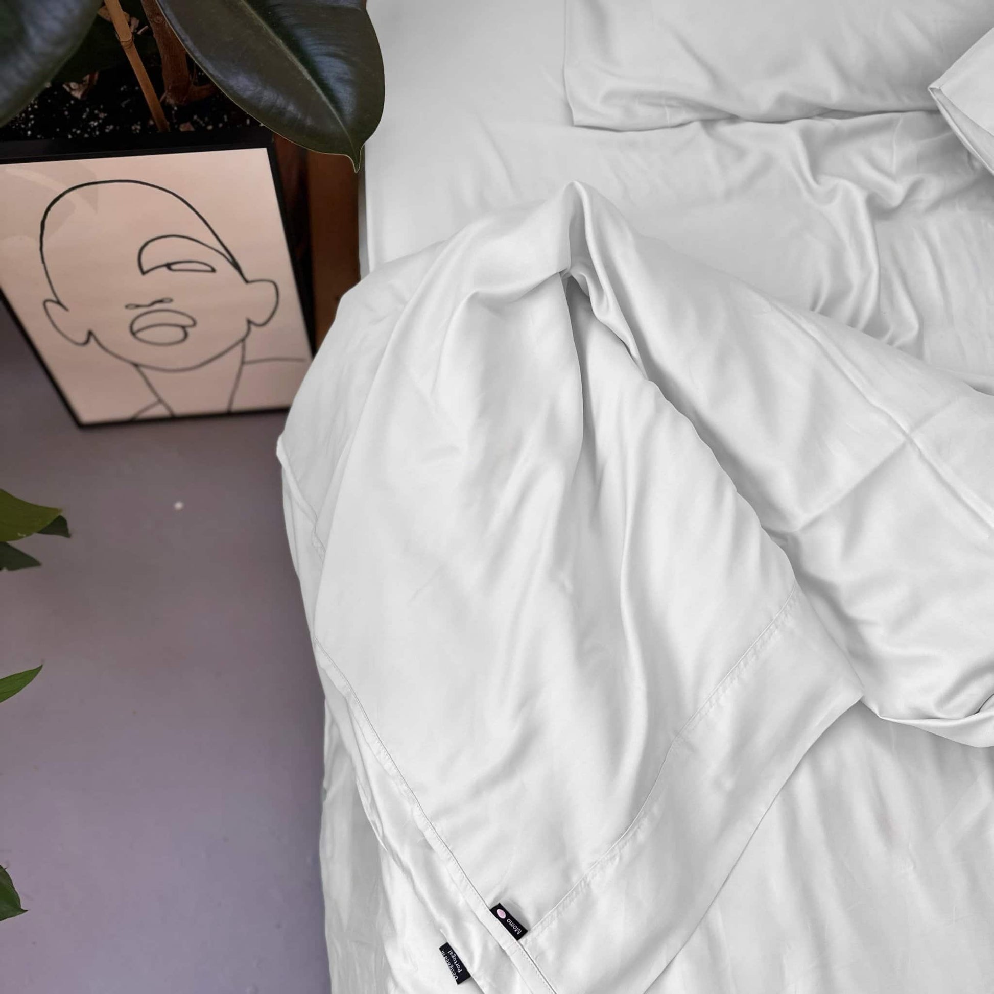 Close-up of white bamboo complete bedding set – duvet, sheets and pillows, soft, breathable and sustainable