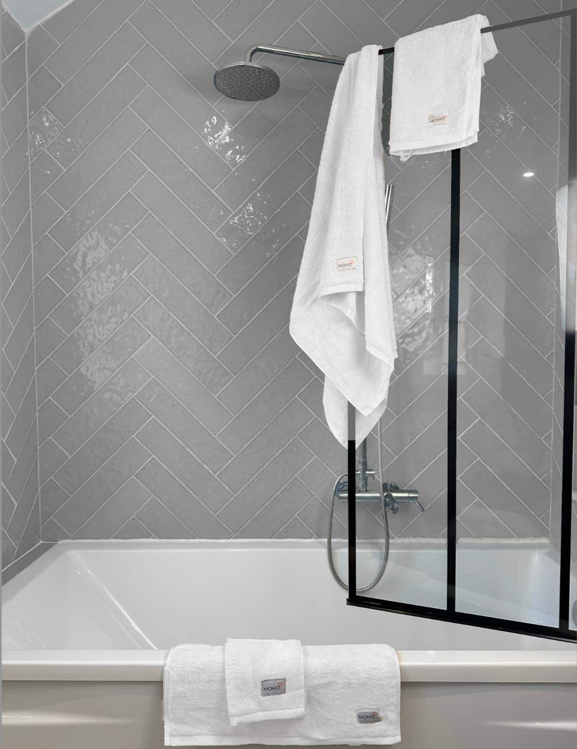 Complete white bamboo towel set on shower – bath, hand and face towels, soft, absorbent and sustainable