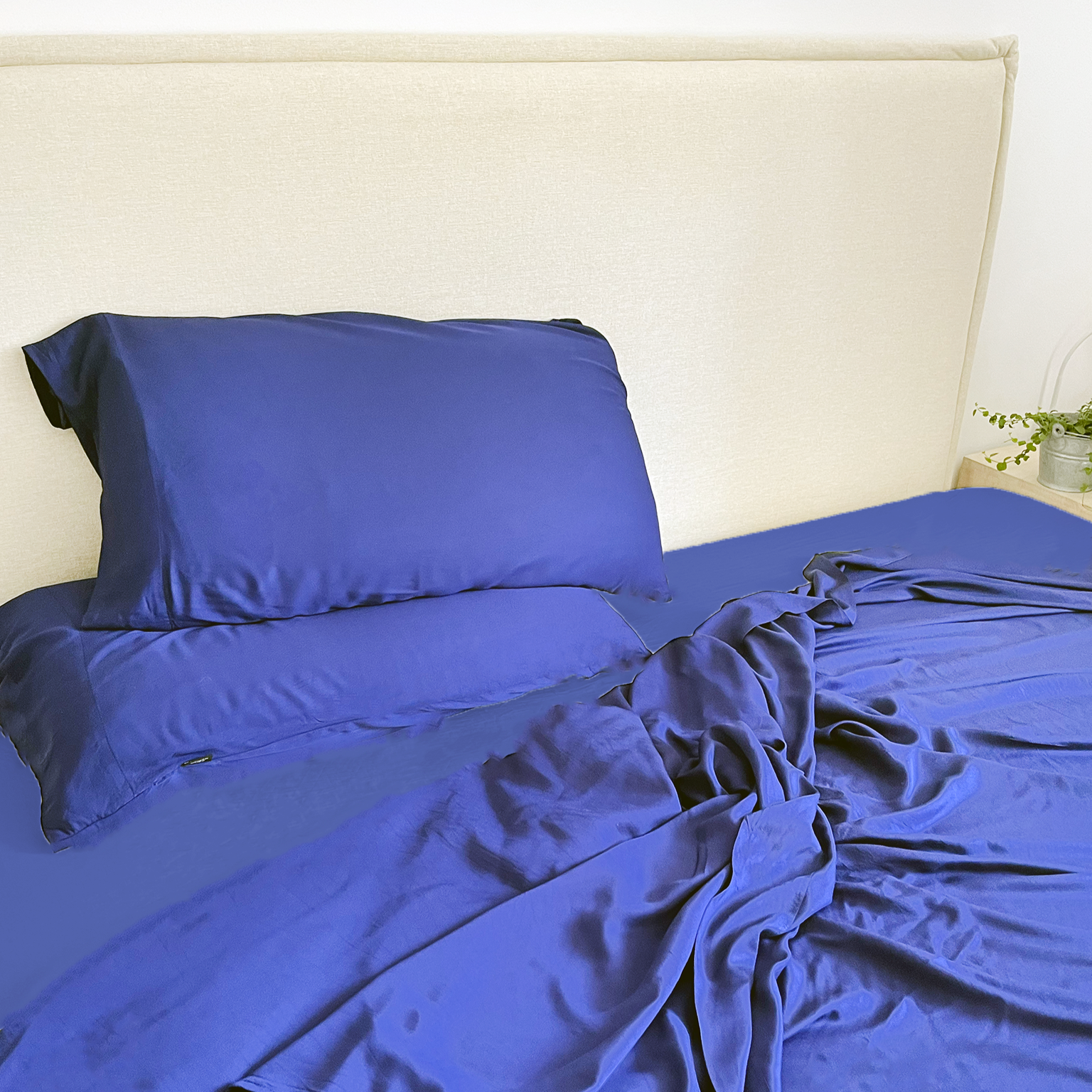 Dark blue bamboo flat sheet set on bed – sheets and pillowcases, soft, breathable and sustainable