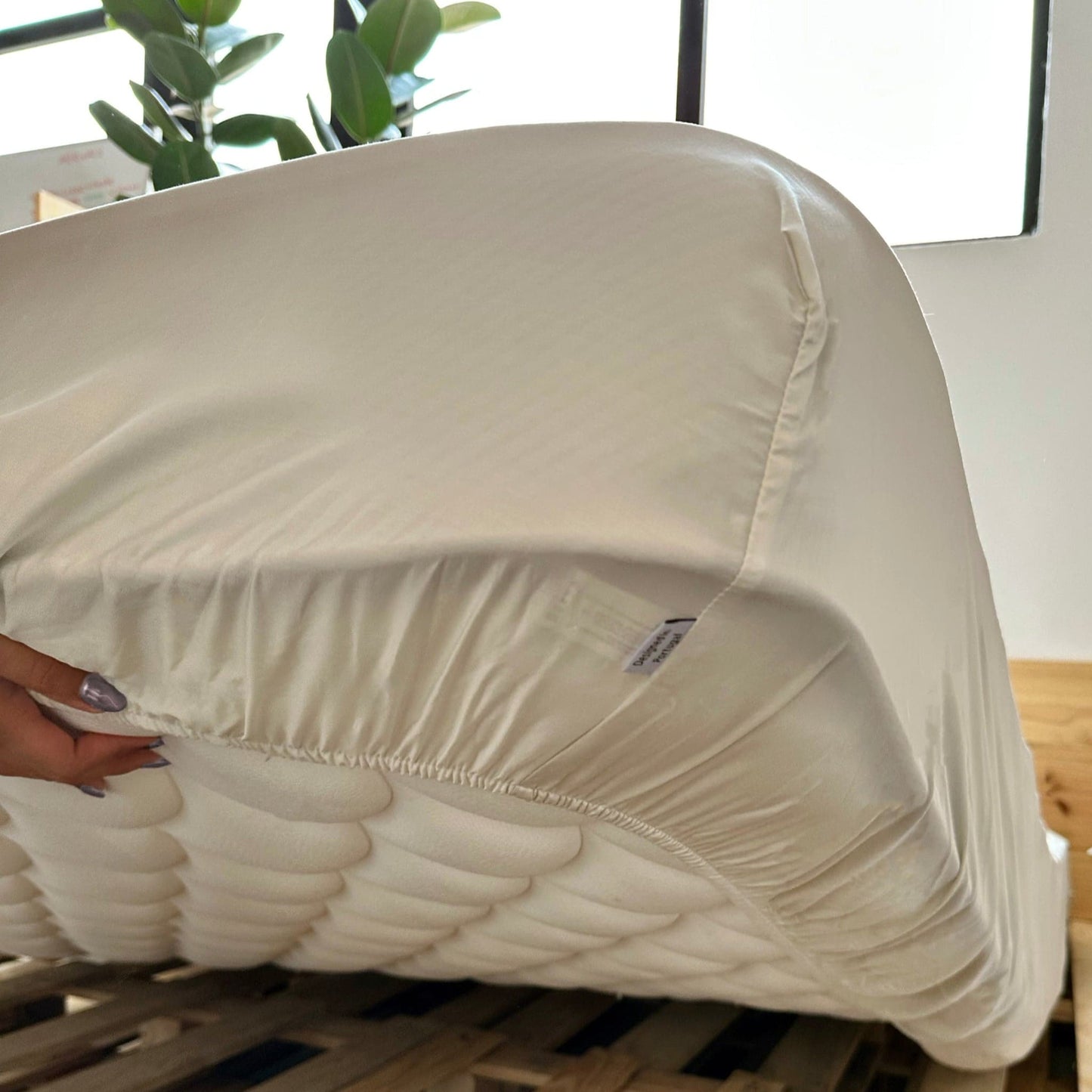 Close-up of beige bamboo fitted sheet – soft, breathable and sustainable bedding
