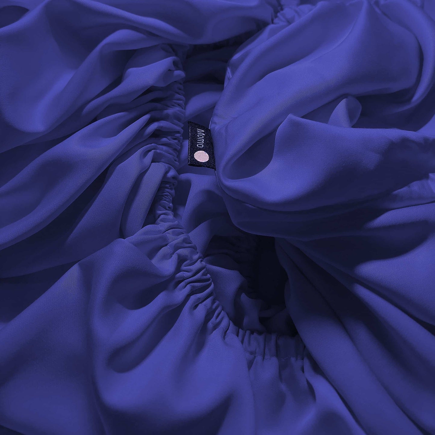 Close-up of dark blue bamboo fitted sheet – soft, breathable and sustainable bedding