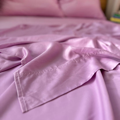 Close-up of lilac bamboo flat sheet seams – soft, breathable and sustainable bedding