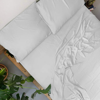 Top view of white bamboo flat sheet set – sheets and pillowcases, soft, breathable and sustainable bedding