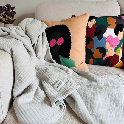 Grey bamboo blanket on couch – soft, breathable and sustainable