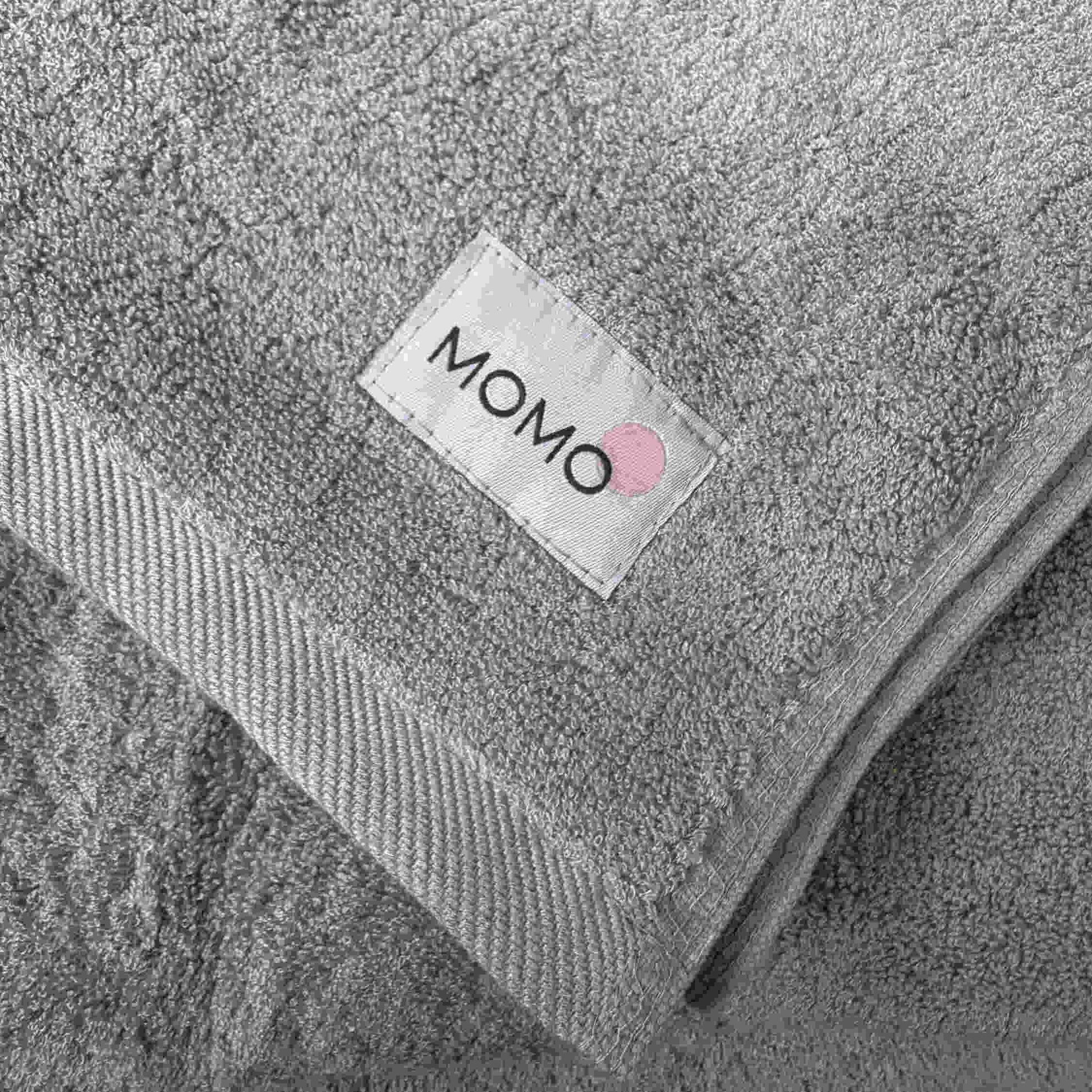 Closeup of Momo bamboo fabric label – sustainable, soft and premium quality detail