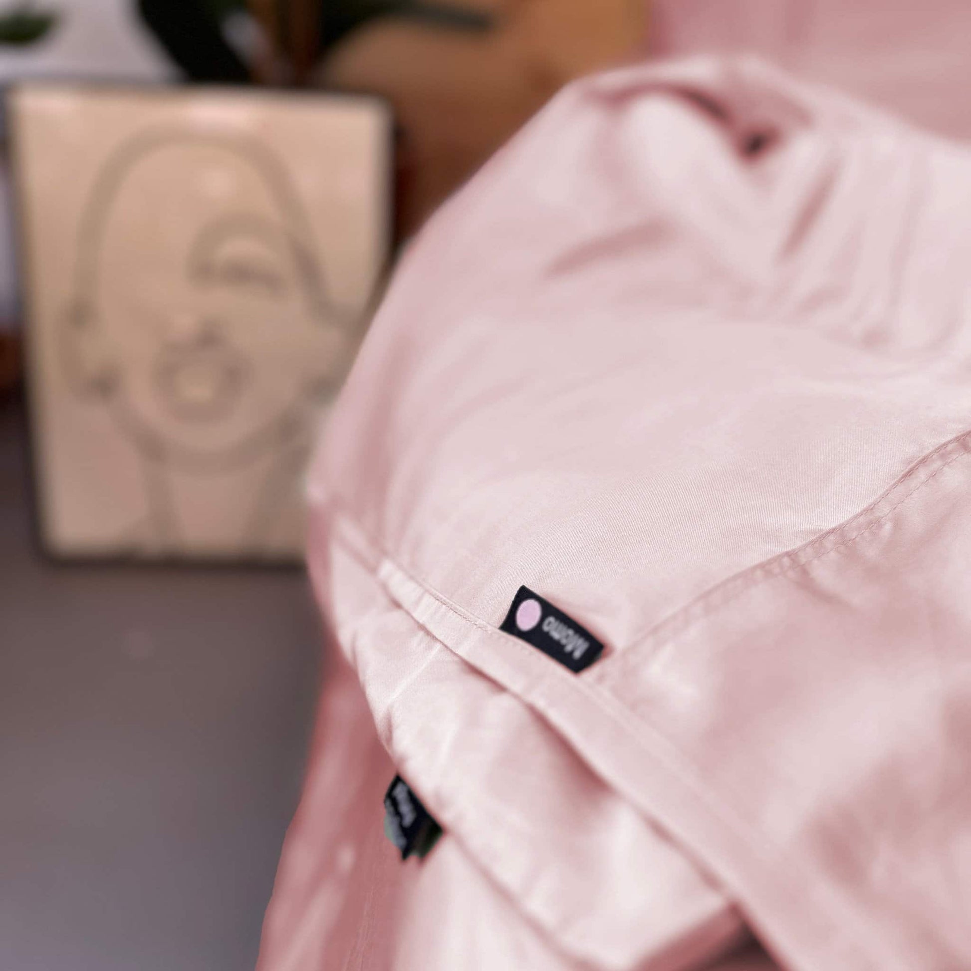 Close-up of pink bamboo bedding set – duvet, sheets and pillows, soft, breathable and sustainable