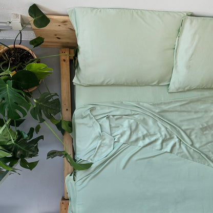 Top view of green bamboo flat sheet set – sheets and pillowcases, soft, breathable and sustainable bedding