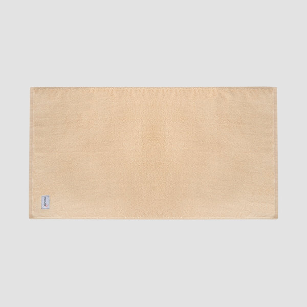 Tapete de baño beis de bambú Momo Cotton – suave, absorbente, secado rápido y sostenible.