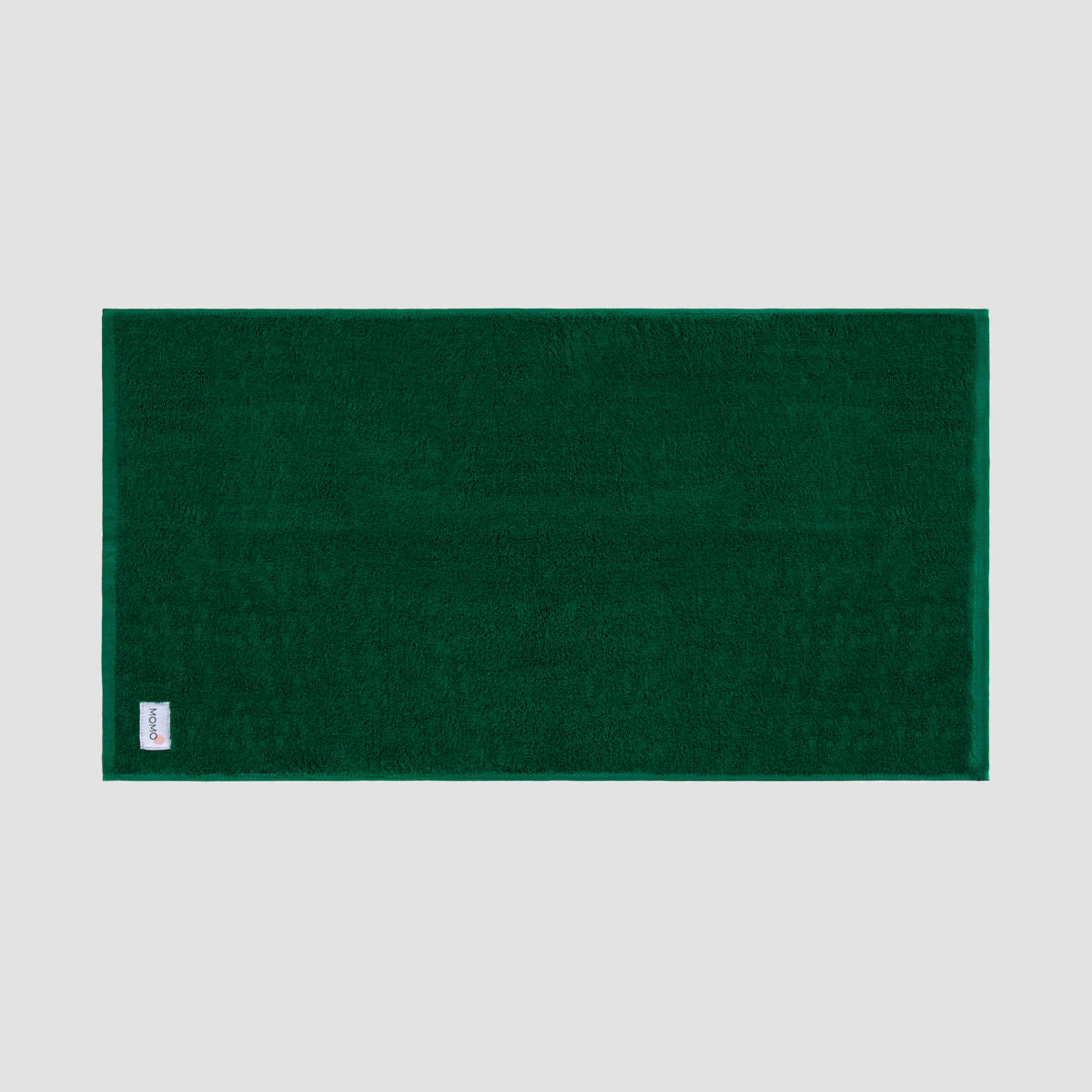 Tapete de banho verde em bambu da Momo Cotton – suave, absorvente, seca rapidamente e sustentável.