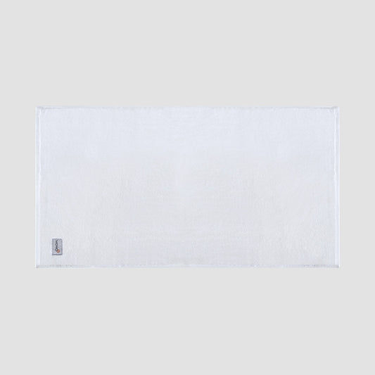 Tapete de banho branco em bambu da Momo Cotton – suave, absorvente, seca rapidamente e sustentável.