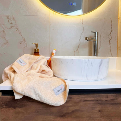 Beige bamboo washcloth in mood shot – soft, absorbent and sustainable