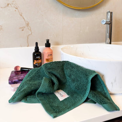 Green bamboo washcloth in mood shot – soft, absorbent and sustainable