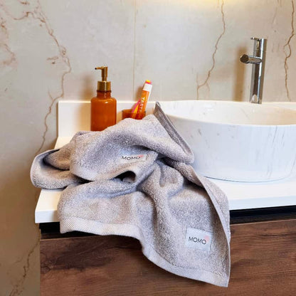 Gray bamboo washcloth in mood shot – soft, absorbent and sustainable